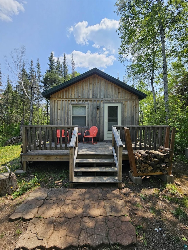 839 Loon Rd, Two Harbors, MN 55616 - rear view of property featuring board and batten siding and a wooden deck