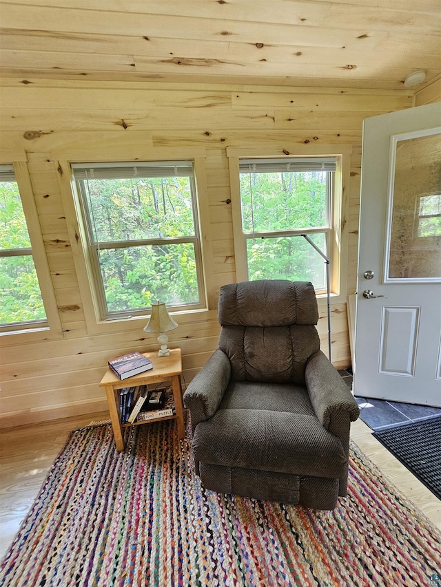 839 Loon Rd, Two Harbors, MN 55616 - sitting room featuring wood walls, healthy amount of natural light, and wood finished floors