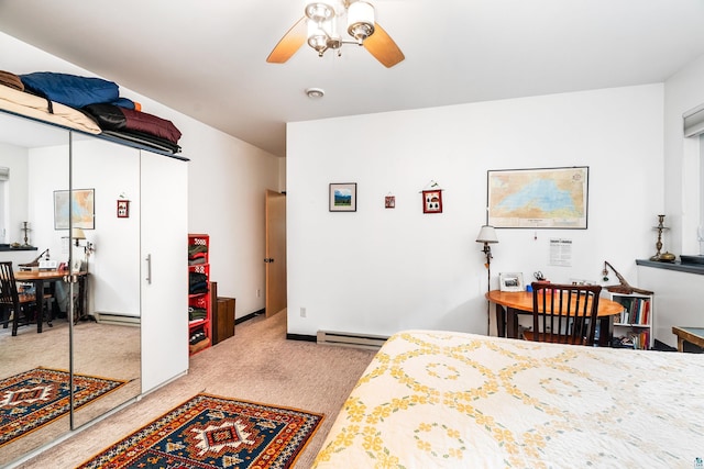 14 W 5th St Unit 1, Duluth, MN 55806 - bedroom with carpet, baseboard heating, and a ceiling fan