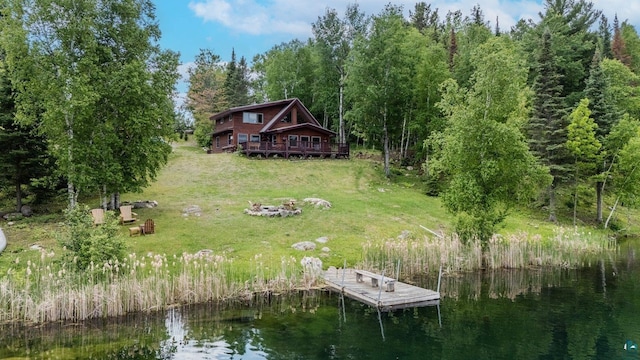 1543 E Miners Lk, Ely, MN 55731 - dock featuring a yard, a deck with water view, and a fire pit
