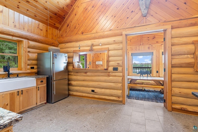 1543 E Miners Lk, Ely, MN 55731 - kitchen featuring freestanding refrigerator, a sink, vaulted ceiling, wooden ceiling, and rustic walls