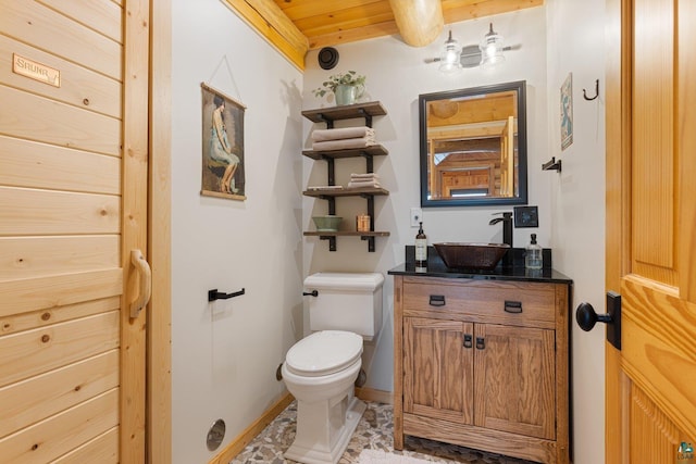 1543 E Miners Lk, Ely, MN 55731 - bathroom featuring toilet, vanity, wood ceiling, and baseboards