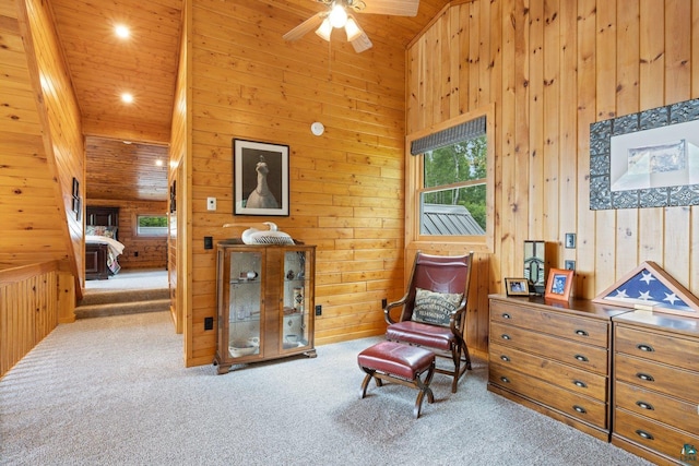 1543 E Miners Lk, Ely, MN 55731 - sitting room featuring wooden walls, carpet, ceiling fan, wood ceiling, and a towering ceiling