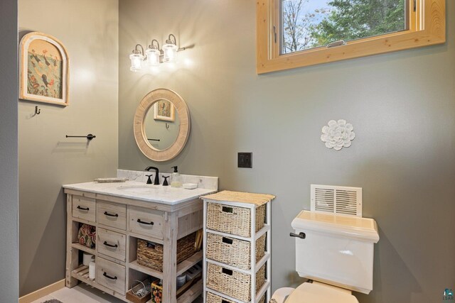 1543 E Miners Lk, Ely, MN 55731 - bathroom featuring vanity, toilet, and baseboards