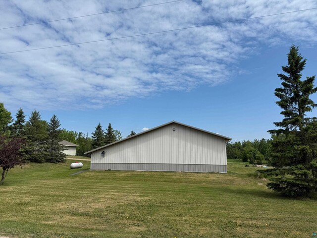 11391 Briski Rd, Chisholm, MN 44719 - view of home's exterior featuring a pole building, a yard, and an outbuilding