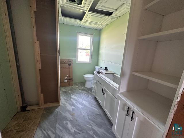 709 Summitt St, Aurora, MN 55705 - bathroom featuring toilet and vanity