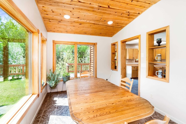 1682 Old N Shore Rd, Duluth, MN 55804 - dining room with lofted ceiling, dark marble finish flooring, and wood ceiling