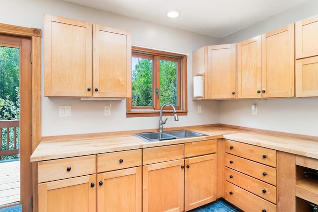 1682 Old N Shore Rd, Duluth, MN 55804 - kitchen with light brown cabinetry, wood counters, a sink, and plenty of natural light