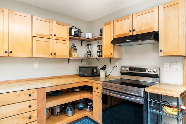 1682 Old N Shore Rd, Duluth, MN 55804 - kitchen featuring stainless steel electric range oven, under cabinet range hood, butcher block counters, light brown cabinetry, and open shelves