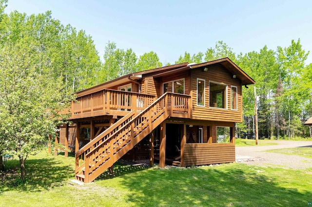 1682 Old N Shore Rd, Duluth, MN 55804 - rear view of property featuring a wooden deck, a yard, and stairs