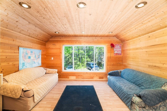 1682 Old N Shore Rd, Duluth, MN 55804 - living room featuring lofted ceiling, wood ceiling, wooden walls, and wood finished floors