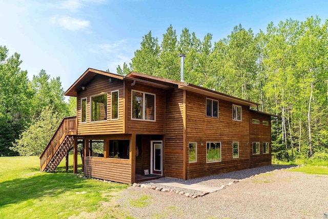 1682 Old N Shore Rd, Duluth, MN 55804 - back of property with a lawn, stairs, and a wooden deck