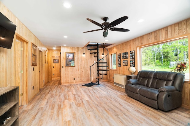 1682 Old N Shore Rd, Duluth, MN 55804 - living room with wooden walls, stairs, wood finished floors, recessed lighting, and ceiling fan