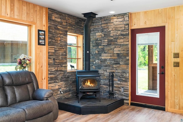 1682 Old N Shore Rd, Duluth, MN 55804 - living room with a wood stove, wood finished floors, and wooden walls