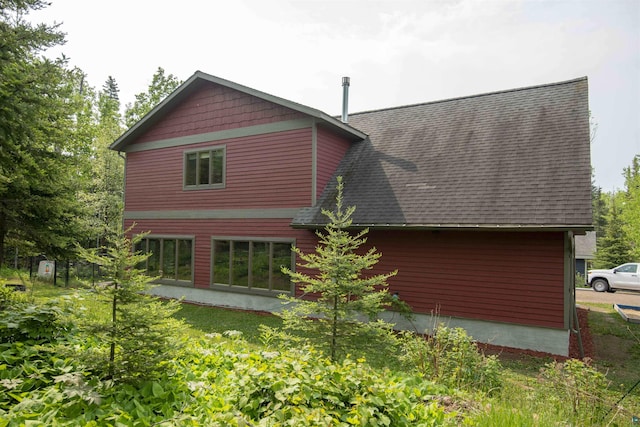 23 Senty Rd, Grand Marais, MN 55604 - back of house featuring a shingled roof