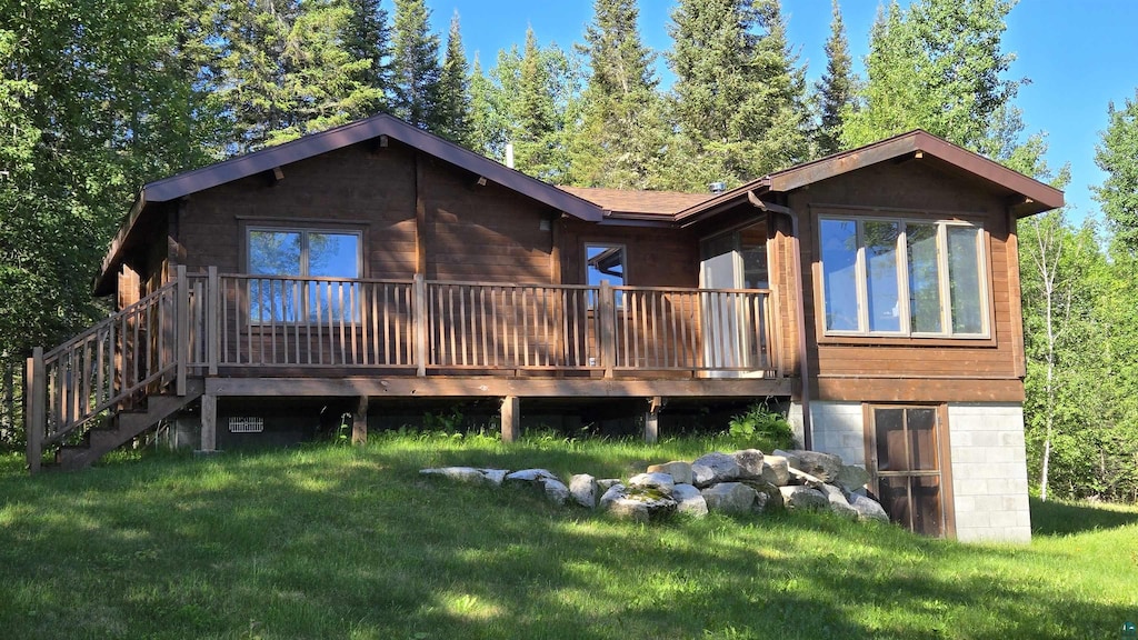 7490 Bayside Dr, Crane Lake, MN 55725 - back of house featuring a yard and a deck