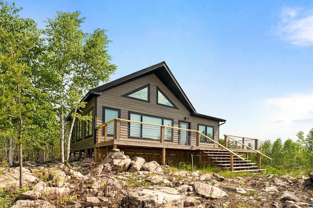12157 Gunflint Trl, Grand Marais, MN 55604 - view of front facade with stairs and a deck