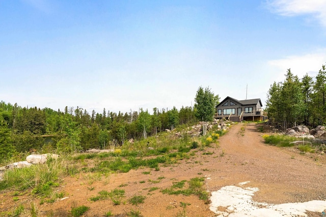 12157 Gunflint Trl, Grand Marais, MN 55604 - view of yard featuring driveway and a view of trees