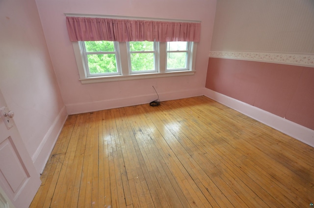 1201 N 59th Ave W, Duluth, MN 55807 - spare room with plenty of natural light and hardwood / wood-style flooring