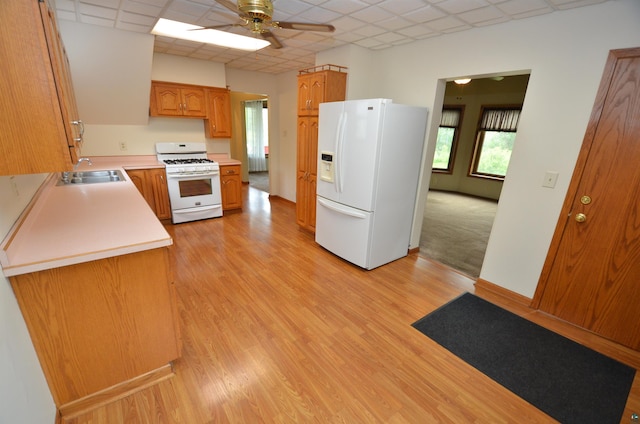 1201 N 59th Ave W, Duluth, MN 55807 - kitchen featuring white appliances, a drop ceiling, a ceiling fan, light countertops, and brown cabinets