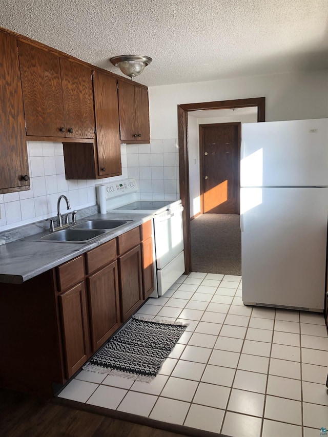 6509 Broadway St, Finlayson, MN 55735 - kitchen with white appliances, a textured ceiling, backsplash, and light countertops