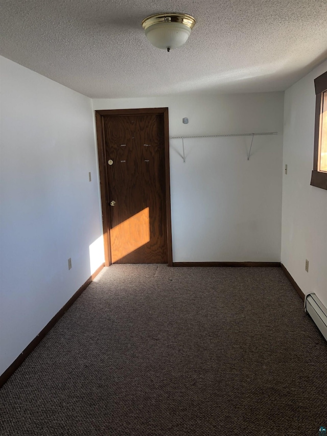 6509 Broadway St, Finlayson, MN 55735 - carpeted spare room featuring a textured ceiling and baseboards