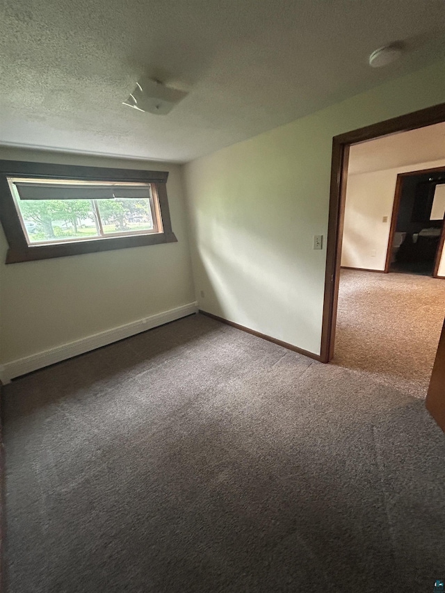 6509 Broadway St, Finlayson, MN 55735 - empty room with carpet flooring and a textured ceiling