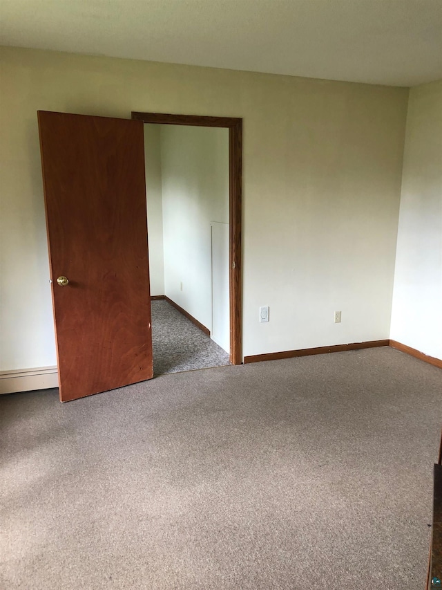 6509 Broadway St, Finlayson, MN 55735 - spare room with carpet and a baseboard heating unit