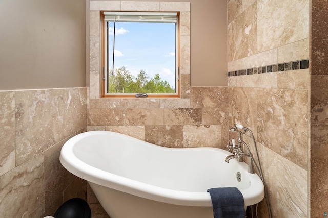 15 Big Cedar Trl, Lutsen, MN 55612 - full bath with tile walls, a freestanding tub, plenty of natural light, and a wainscoted wall
