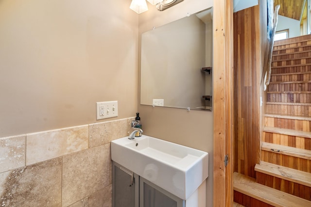 15 Big Cedar Trl, Lutsen, MN 55612 - bathroom featuring vanity and a wainscoted wall