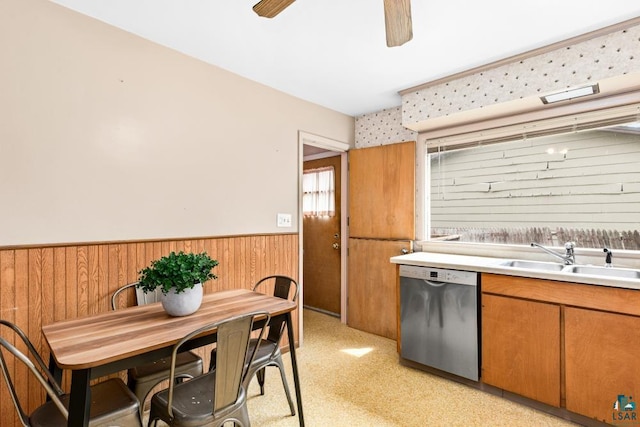 1155 Brainerd Ave, Duluth, MN 55803 - kitchen with dishwasher, wainscoting, ceiling fan, wooden walls, and light countertops
