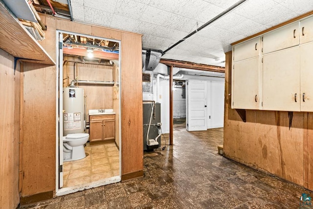 1155 Brainerd Ave, Duluth, MN 55803 - unfinished below grade area featuring dark floors, gas water heater, and wood walls