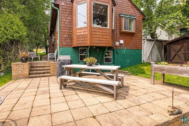 1410 N 7th Ave E, Duluth, MN 55805 - view of patio / terrace featuring a storage unit, outdoor dining space, and area for grilling