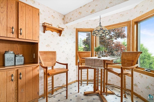 1410 N 7th Ave E, Duluth, MN 55805 - dining room featuring wallpapered walls, healthy amount of natural light, and a chandelier