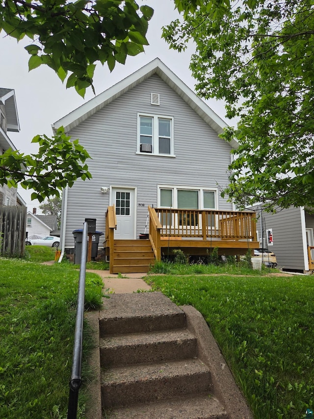 808 N 6th Ave E, Duluth, MN 55805 - back of house featuring a deck and a lawn