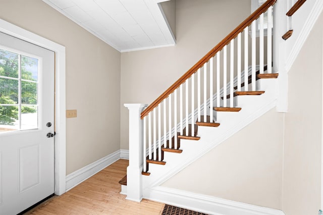 808 N 6th Ave E, Duluth, MN 55805 - entrance foyer with wood finished floors, ornamental molding, and stairs