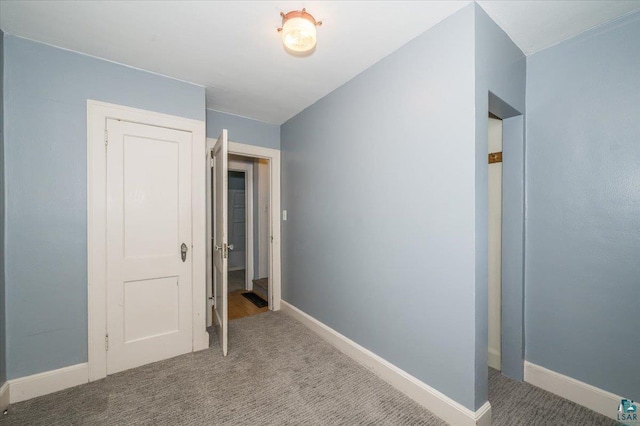 117 W Toledo St, Duluth, MN 55811 - unfurnished bedroom featuring carpet floors