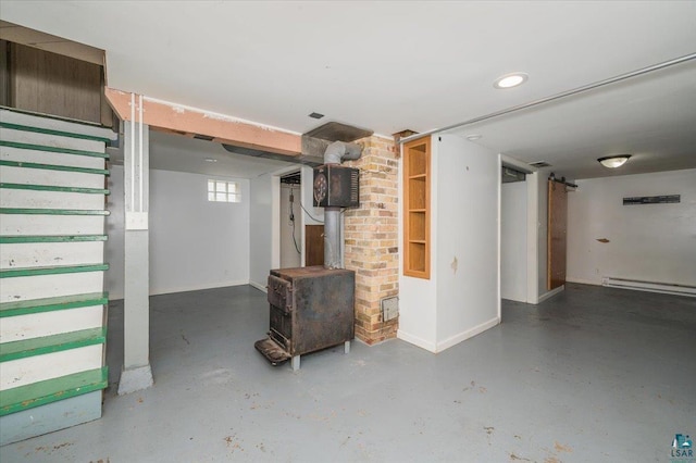 117 W Toledo St, Duluth, MN 55811 - basement with a wood stove and a baseboard radiator