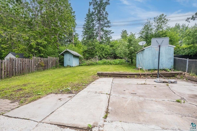 117 W Toledo St, Duluth, MN 55811 - fenced backyard featuring a shed and a patio