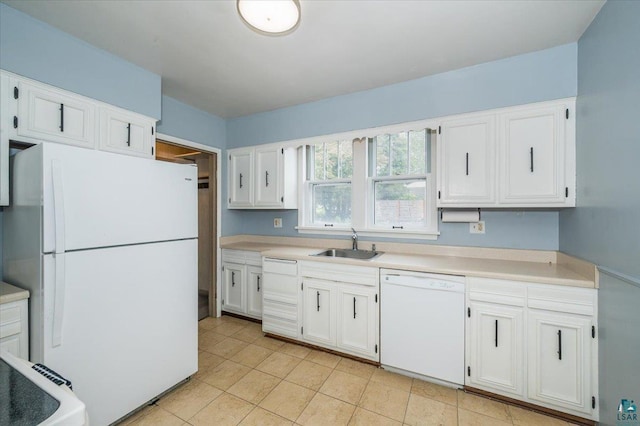 117 W Toledo St, Duluth, MN 55811 - kitchen featuring white appliances, white cabinets, light countertops, and light tile patterned flooring