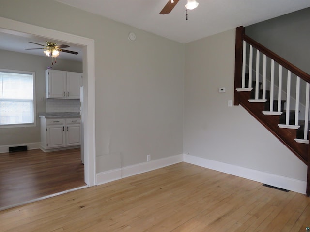 522 S 71st Ave W, Duluth, MN 55807 - unfurnished living room with a ceiling fan, light wood-type flooring, and stairway