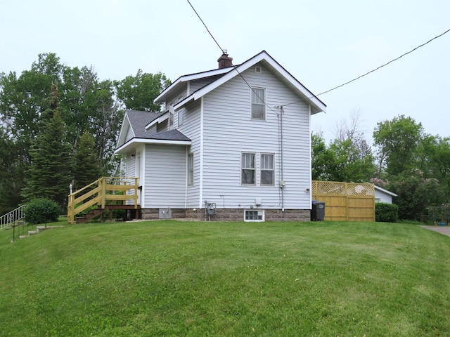 522 S 71st Ave W, Duluth, MN 55807 - back of property featuring a chimney and a lawn