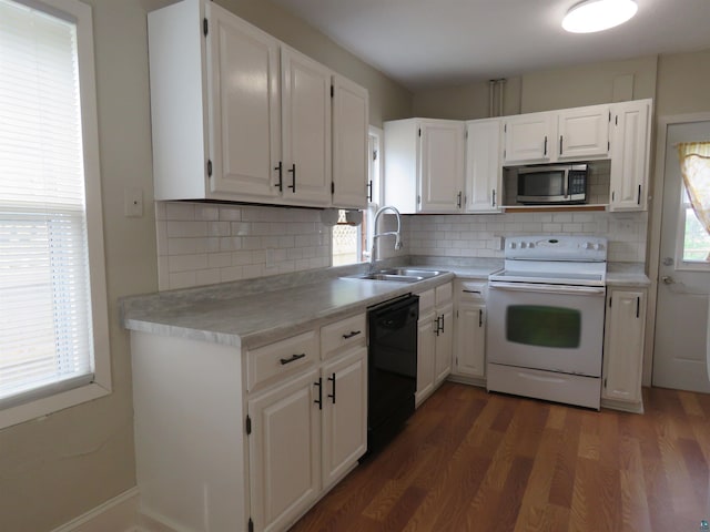522 S 71st Ave W, Duluth, MN 55807 - kitchen featuring electric stove, stainless steel microwave, black dishwasher, and healthy amount of natural light