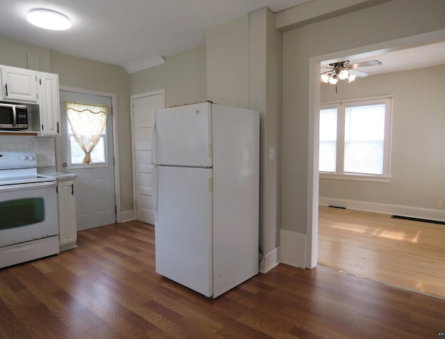 522 S 71st Ave W, Duluth, MN 55807 - kitchen with white appliances, dark wood-type flooring, healthy amount of natural light, and white cabinetry