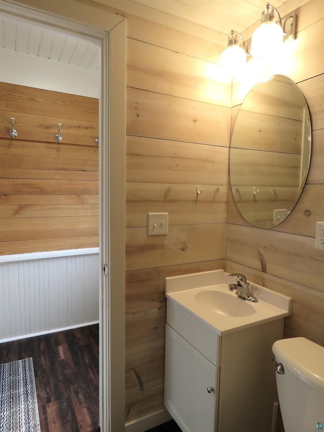 522 S 71st Ave W, Duluth, MN 55807 - bathroom featuring vanity, wood finished floors, and wood walls