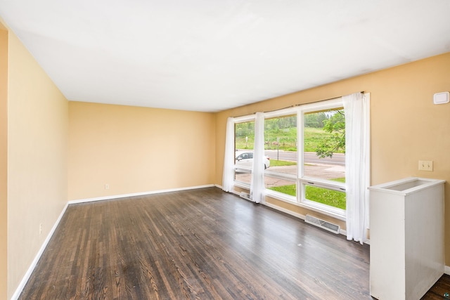 1229 W Arrowhead Rd, Duluth, MN 55804 - empty room featuring dark wood-style flooring and baseboards