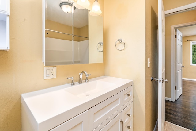 1229 W Arrowhead Rd, Duluth, MN 55804 - bathroom featuring vanity and wood finished floors