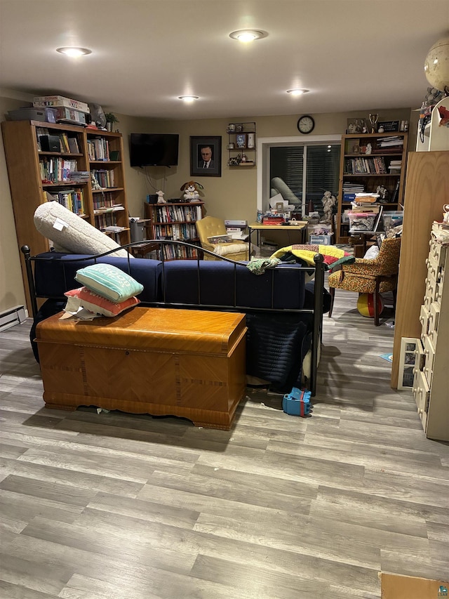 722 8th St S, Virginia, MN 55792 - living room featuring wood finished floors and a baseboard heating unit