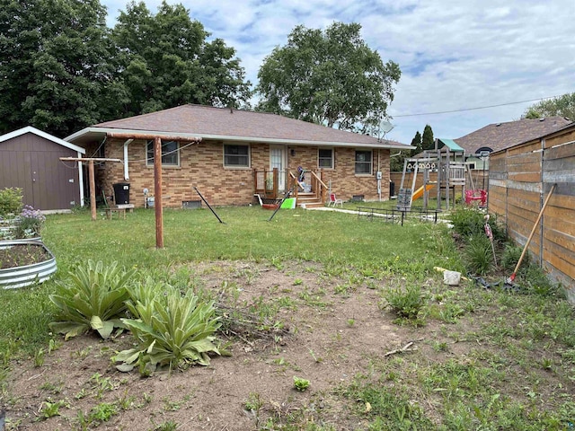 722 8th St S, Virginia, MN 55792 - back of house featuring a playground, brick siding, and a storage unit