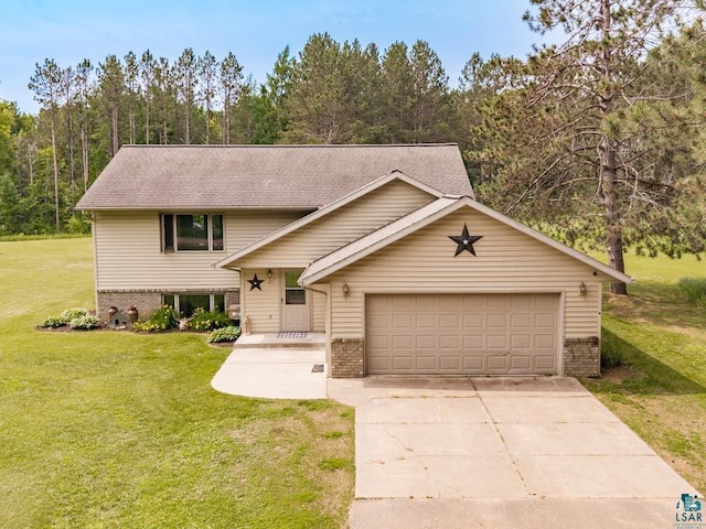 1464 Heather Ln, Cromwell, MN 55726 - view of front of house featuring brick siding, a front yard, concrete driveway, and an attached garage